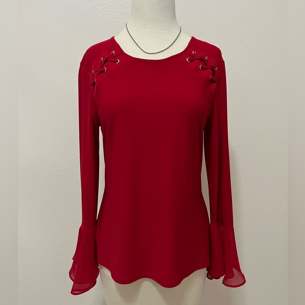 Red blouse. One time used. In good condition